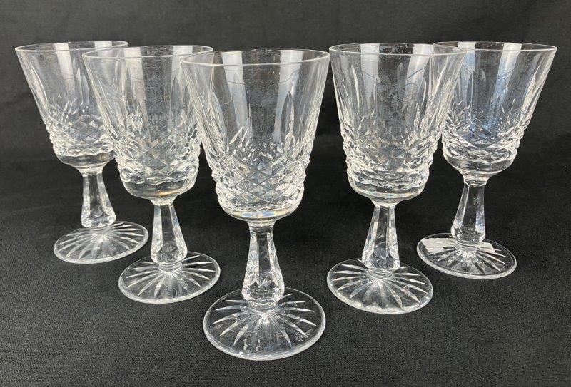 Five Waterford Lismore Goblets: A group of classic Waterford Lismore goblets featuring the iconic cut-crystal pattern. Each measures approximately 6" H x 3" in diameter. In good condition.