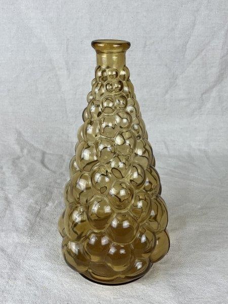 Vintage Italian Empoli Genie Bottle: A vintage Italian Empoli hand-blown glass genie bottle featuring a textured surface resembling a cluster of grapes. Measures approximately 10 7/8" H x 5 3/8" W x 5 3/8" D. In good condition, missing t