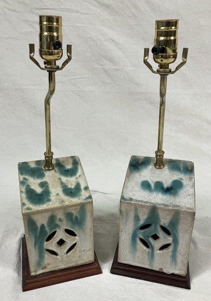 Pair of Chinese Pierced Pottery Lamps: Pair of hand-built lamps featuring a beautiful speckled glaze with green slip decoration. One measures approximately 18 3/4" H x 6" W x 6" D. Good condition; untested.