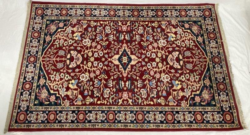 Karastan Shalamzar Rug: A Karastan Shalamzar pattern rug woven in 100% wool, featuring classic design elements and rich coloration characteristic of the line. Measures approximately 69" x 102". In good condition with light w