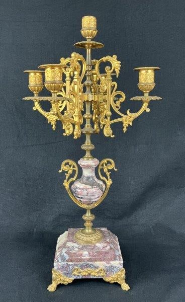 French Gilt and Marble Candelabra: A French Louis-style gilt and marble candelabra blending curving Louis XV–inspired lines with the urn form and neoclassical base characteristic of Louis XVI design. Features a rose-toned marble