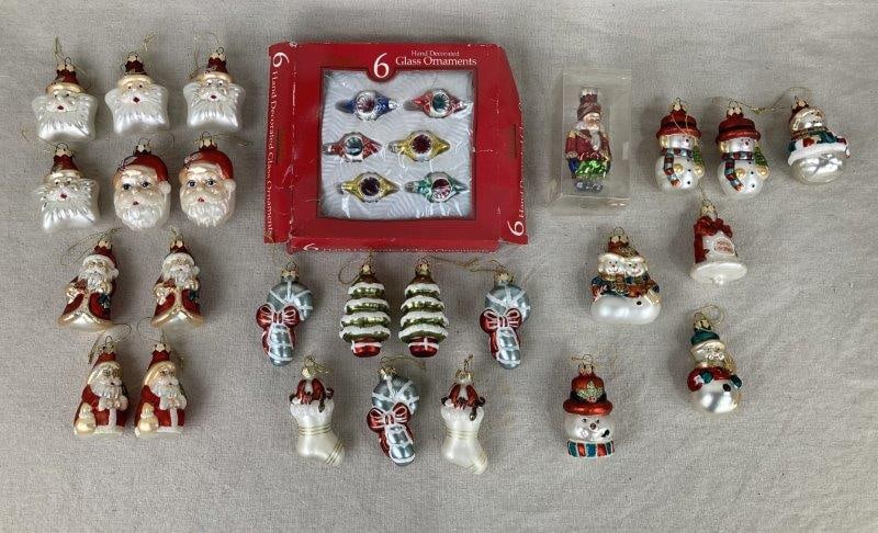 Vintage Painted Glass Christmas Tree Ornaments: A festive collection of vintage painted glass Christmas ornaments featuring Santa figures, Christmas trees, and additional holiday motifs. The largest ornament measures approximately 3 1/4" H x 1 1/2"