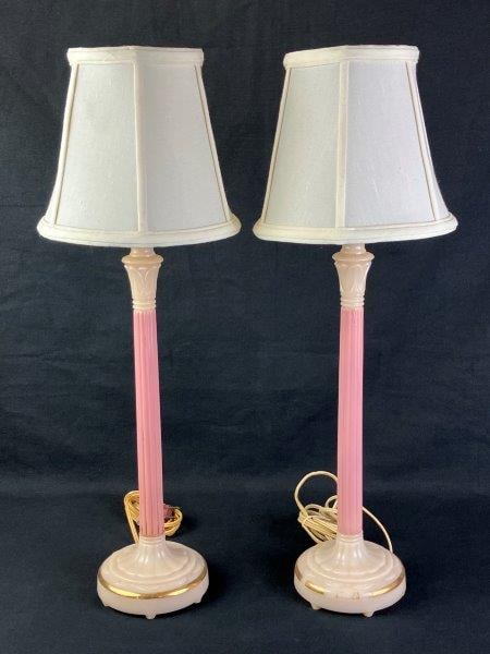 Pair of Vintage Pink Opaline Glass Lamps: A pair of vintage two-toned pink opaline glass lamps in an elegant columnar form, accented with gilded details. One lamp measures approximately 23" H x 6" in diameter including the shade. Shows genera