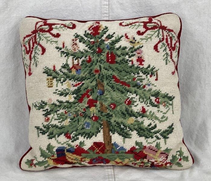 Christmas Tree Needlepoint Pillow: Charming needlepoint pillow featuring a Christmas tree with presents beneath, crafted on a red velvet-like fabric. Measures approximately 12 7/8" H x 13" W x 4" D. Good condition.