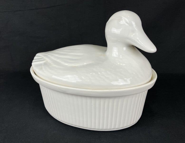 California Pottery Duck Tureen: An elegant white California Pottery duck tureen featuring smooth sculptural detail and classic mid-century form. Measures approximately 9" H x 10 5/8" W x 7 1/2" D. In good condition.