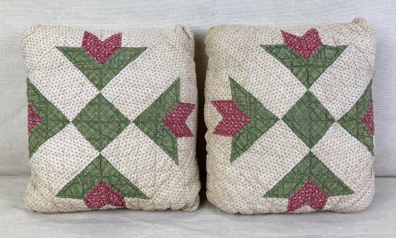 Pair of Chintz Quilted Pillows: Pair of antique quilted pillows crafted from early 19th century chintz fabric, featuring patchwork construction with charming floral designs and a soft, aged patina. One pillow measures approx. 9 3/4"