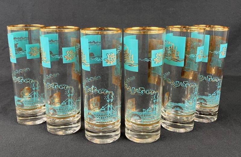 Libbey Southern Comfort Steamboat Highball Glasses: Set of vintage highball glasses decorated in turquoise tones with gilt steamboat motifs, characteristic of Libbey's mid-century promotional designs. Each measures approximately 6 5/8" H x 2 3/8" in di
