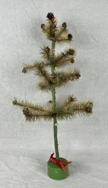 Feather Christmas Tree: Charming feather tree featuring a wrapped trunk, crisp green needles, scattered pinecones, and a polka-dot bow at the base for festive display. Measures approximately 19" H x 9" in diameter. Shows gen