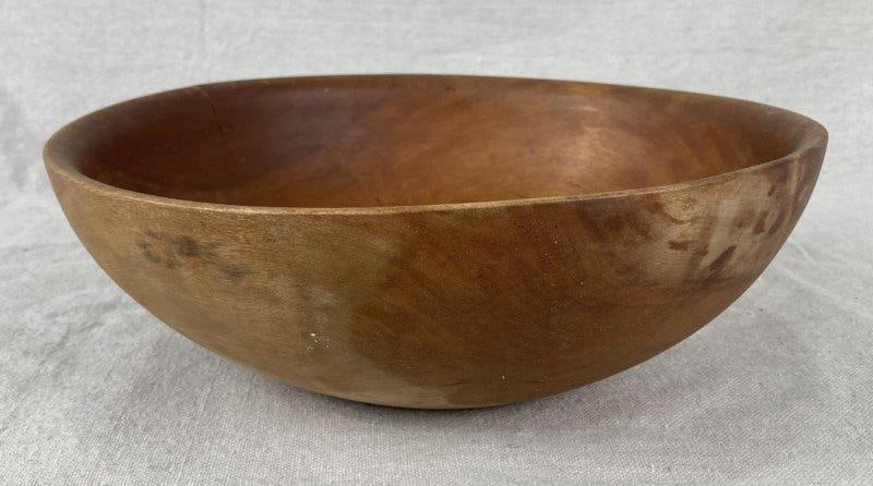 Wood Dough Bowl: Beautifully turned wooden bowl showcasing a warm honey-toned surface and smooth handcrafted form. Exhibits natural grain variation and an appealing aged patina. Measures approximately 3 1/4" H x 9 5/8