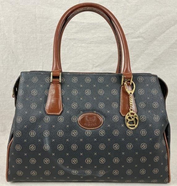 Beauty Italian Monogram Shoulder Bag: Beauty Italian shoulder bag featuring a pebbled-leatherâ€“style monogrammed exterior with smooth leather accents and gold tone hardware, including a top zip closure. A classic structu