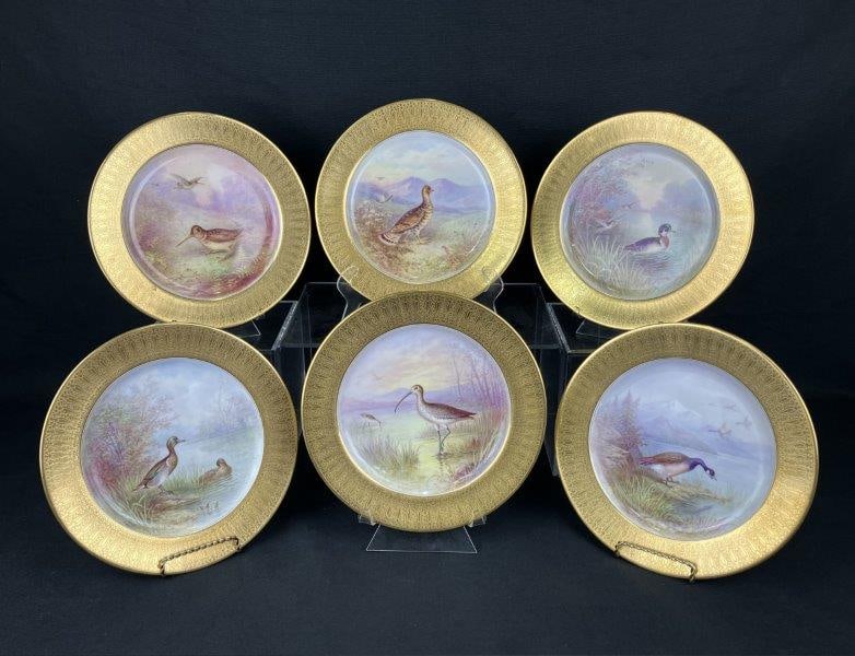 William H. Morley For Tiffany Game Bird Cabinet Plates: A group of porcelain game bird plates produced by Tiffany & Co. in collaboration with Lenox and hand painted by William H. Morley. Each plate features a gilt-decorated rim and finely hand-painted game