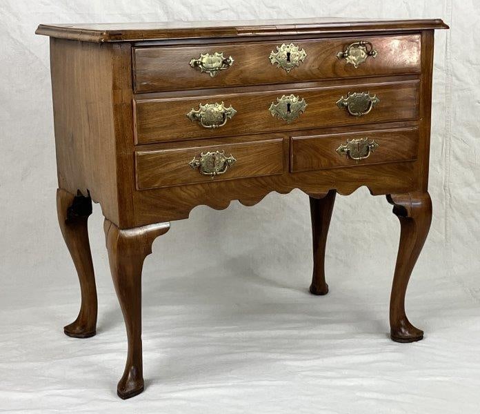 George I Inlaid Walnut Lowboy, First Quarter 18th Century: An exceptional early 18th-century George I walnut lowboy, the rectangular cross-banded molded top set above two short and two long drawers, raised on graceful cabriole legs terminating in scrolled toe