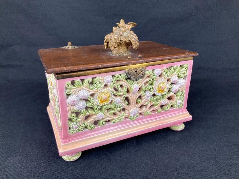 Zsolnay Reticulated Pottery Box: A footed reticulated pottery box attributed to Zsolnay, based on the distinctive color palette and finely executed reticulated openwork. The box features delicate floral designs in soft pastel tones a