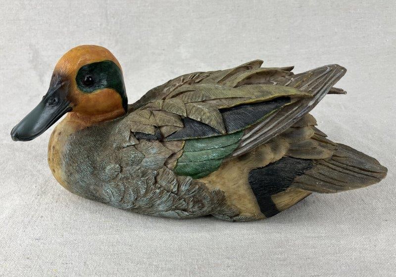 Duck Decoy: A sculptural duck decoy displaying fine feather detail and a well-executed painted finish, offering strong folk appeal and craftsmanship. Measures approximately 6″ H x 10″ W x 5″ D. 