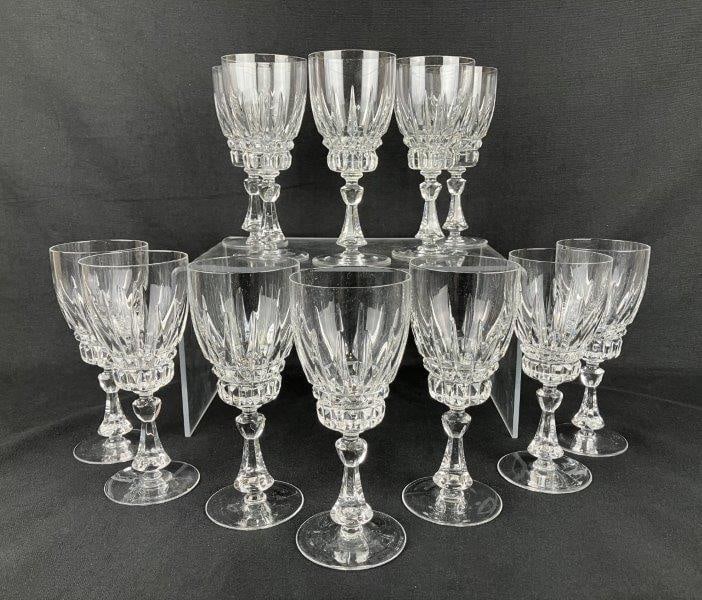Twelve Nachtmann “Astra” Crystal Stemmed Wine Glasses: A group of crystal wine glasses by Nachtmann, in the Astra pattern, featuring crisp cut detailing and clear, luminous crystal. One glass measures approximately 7 1/8″ H x 3″ in diameter. I