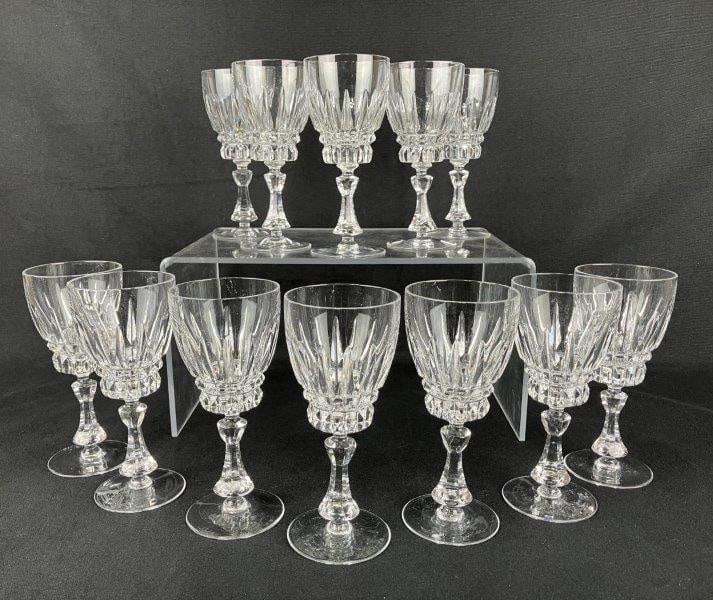 Twelve Nachtmann “Astra” Crystal Stemmed Wine Glasses: A group of crystal wine glasses by Nachtmann, in the Astra pattern, featuring crisp cut detailing and clear, luminous crystal. One glass measures approximately 6 1/4″ H x 2 5/8″ in diamete