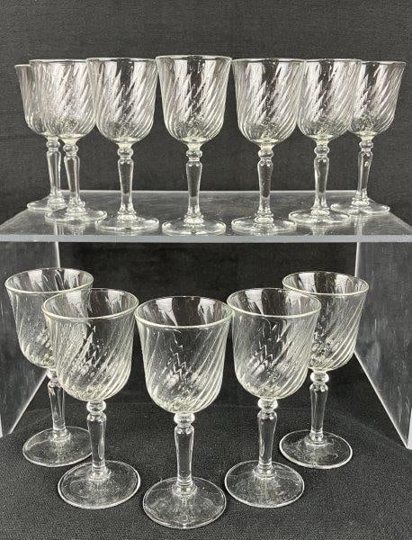 Twelve Cristal d’Arques–Durand Swirl Optic Cordial Glasses: A set of cordial glasses by Cristal d’Arques–Durand, featuring the Angelique or Volute swirl optic pattern. The glasses display rich, luminous clarity with elegant spiral movement characte