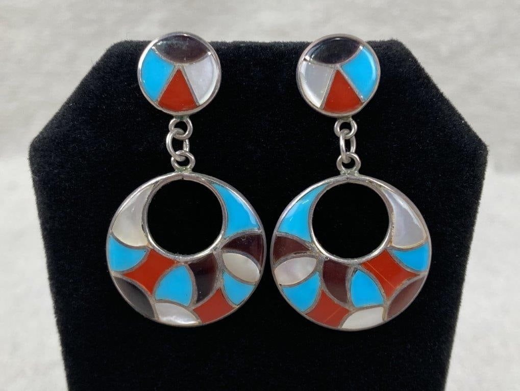 Native American Sterling Silver and Turquoise Dangle Earrings: Native American Zuni-style sterling silver dangle earrings featuring a polished circular form inlaid with moonstone, onyx, turquoise, and coral, showcasing traditional craftsmanship and balanced