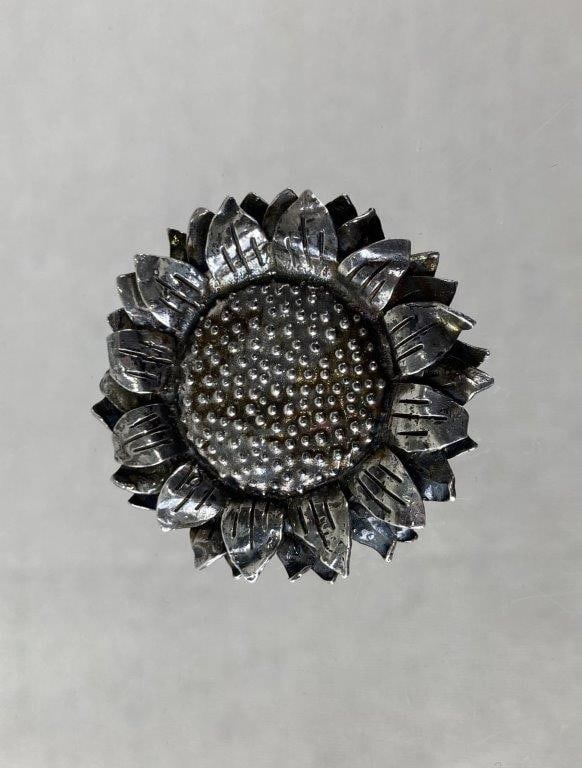 Vintage Sterling Silver Sunflower Brooch: Sterling silver brooch in the form of a sunflower, featuring finely detailed layered petals and a bold sculptural presence. Made by Great Falls Metal Works and stamped 1992 Sterling GF MW. Displays a