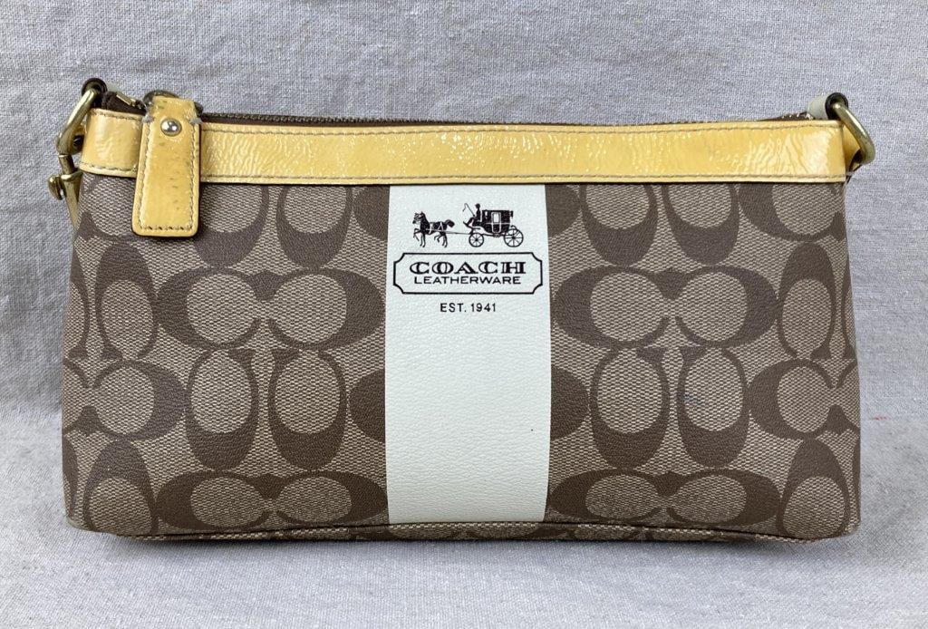 Vintage Coach Signature Stripe Shoulder Bag: Coach shoulder bag featuring the classic khaki Signature C logo canvas accented by a bold white vertical stripe printed Coach Leatherware Est. 1941, contrasted with yellow leather trim around the rim
