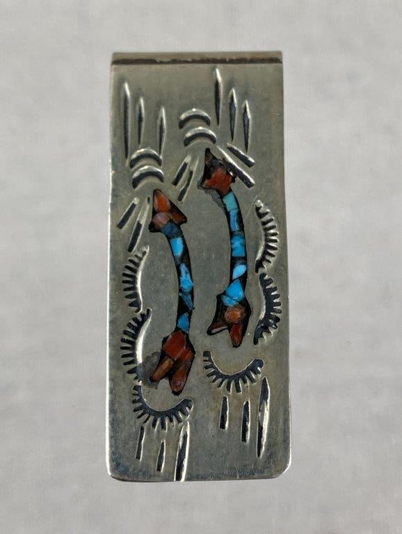 Navajo Sterling Silver and Inlaid Turquoise Money Clip: Navajo sterling silver money clip featuring an inlaid design of arrows and chips of turquoise and coral suspended in resin. Tested for silver content but unmarked. Measures approx. 1 3/4" H x 3/4" W.