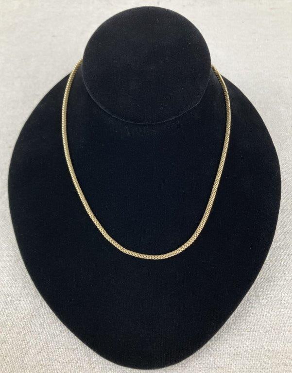 Mesh Sterling Silver Necklace with Gold Vermeil: Sterling silver mesh chain necklace accented with gold vermeil and finished with a lobster claw clasp, offering a flexible, elegant drape. Stamped 925 Italy and designed with adjustable sizing.