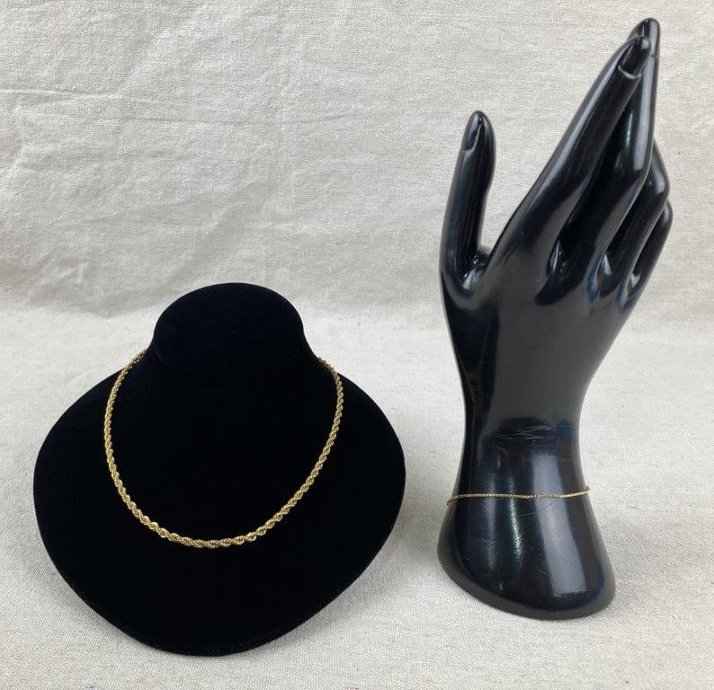 Vintage Napier Goldtone Bracelet and Necklace: Vintage goldtone costume jewelry pair by Napier, comprising a necklace and bracelet. The necklace features a classic rope-style chain, while the bracelet is designed with a simple, delicate goldtone