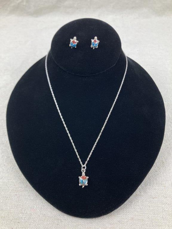 Southwestern Turtle Necklace and Earrings Demi-Parure: Southwestern-style demi-parure comprising a necklace and matching stud earrings, each featuring turtle motifs inlaid with turquoise and coral. The chain is marked for sterling silver content, while