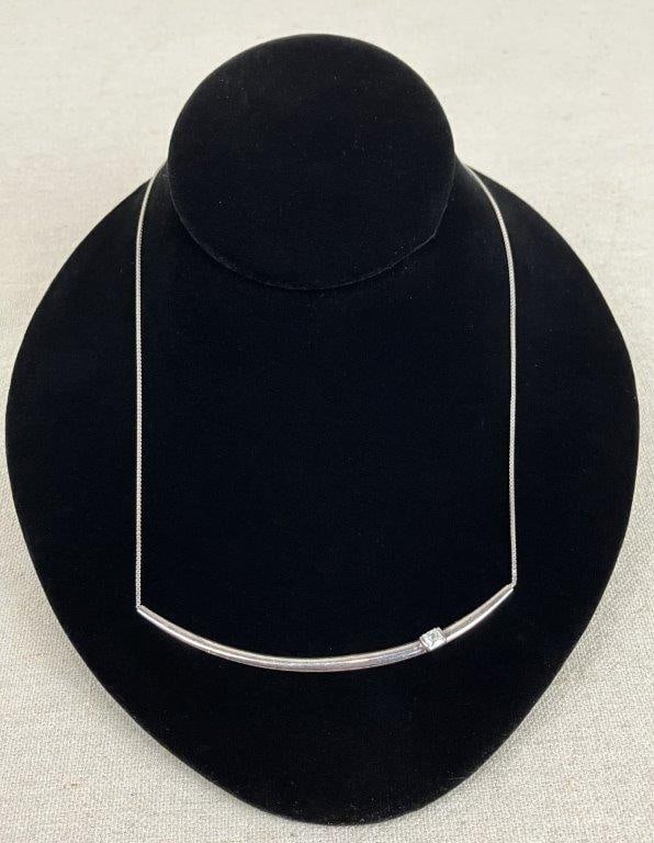 Silpada Sterling Silver Exuberance Bar Necklace: Delicate sterling silver necklace by Silpada, from the Exuberance collection. The design features a clear, faceted cut stone centered within a crescent-form silver surround, creating a refined and