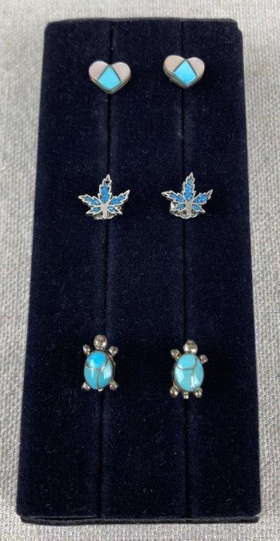 Three Sterling Silver Southwestern Turquoise Earrings: Three-piece group of whimsical Southwestern-style sterling silver stud earrings featuring inlaid turquoise designs, including examples in turtle and heart forms. Unmarked for sterling silver content