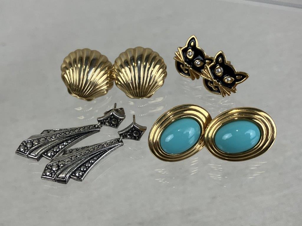 Four-Piece Vintage Earring Assortment: Four-piece assortment of vintage earrings, including a faux jeweled and enamel cat-form pair by Avon. The group also includes two shell earrings, one accented with central turquoise enamel and a