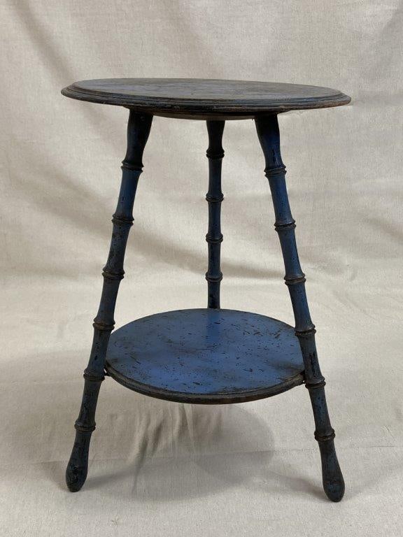 Blue Painted Two-Tiered Stand: A charming blue painted two-tiered stand of tripod form, featuring turned legs skillfully carved to emulate bamboo and supporting circular tiers above. The surface retains a rich blue paint with