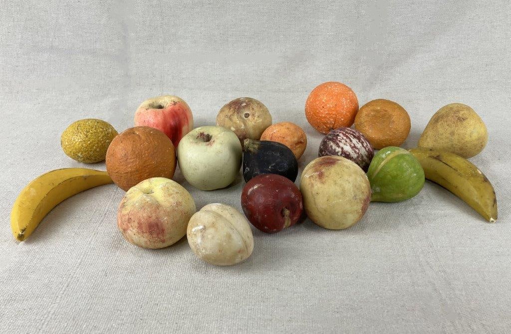 Stone Fruit Assortment: An assortment of eighteen decorative stone fruit, including examples such as banana, pear, orange, apricot, apple, and others. One-piece measures approximately 3″ in diameter. Shows wear and