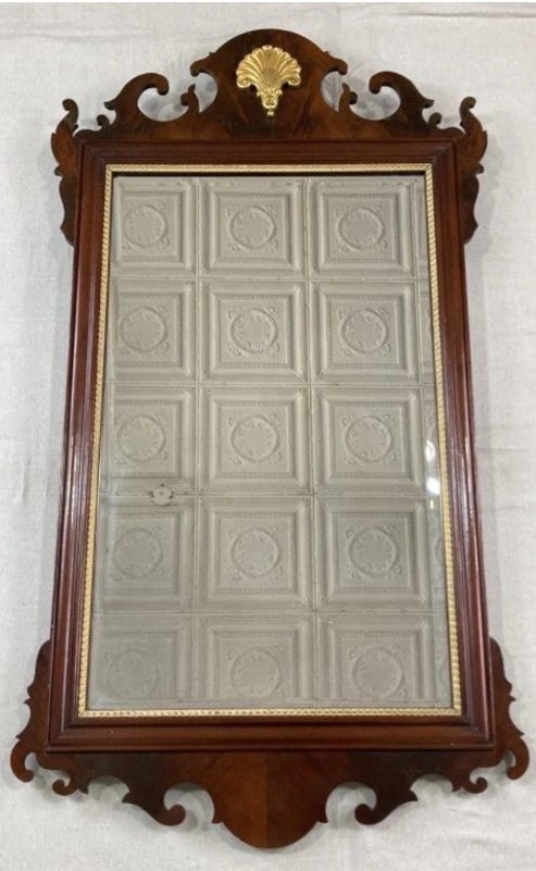 Councill Craftmen Chippendale Mirror: A Chippendale style mirror crafted in rich deep mahogany with a warm, lustrous patina. The frame features a scrolled crest centered with a gilt shell detail, lending refined elegance and traditional