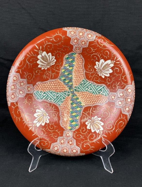 Imari Porcelain Bowl: A Japanese Imari porcelain bowl decorated with distinctive hand-painted red, green, and blue motifs. Measures approximately 2″ H x 10 5/8″ in diameter. Shows general wear consistent with