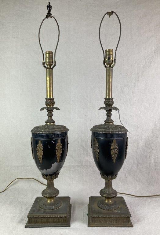 Pair of 19th Century Neoclassical Style Urn Lamps: A pair of 19th century neoclassical-style urn-form table lamps with black painted bodies, set on ornate square bases and embellished with leaf motif decoration. Exhibits a worn, aged patina