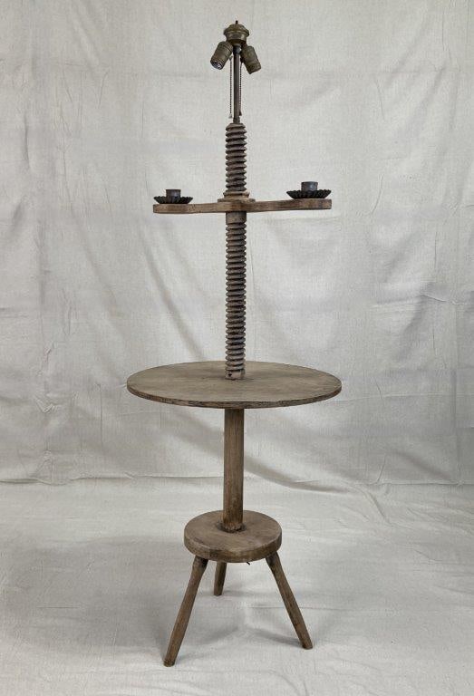 Antique Wooden Candle Screw Jack: An antique wooden candle screw jack featuring a central wood screw mechanism allowing the candle arms to be raised or lowered. Fitted with two pull-chain light bulb sockets to the top and supported