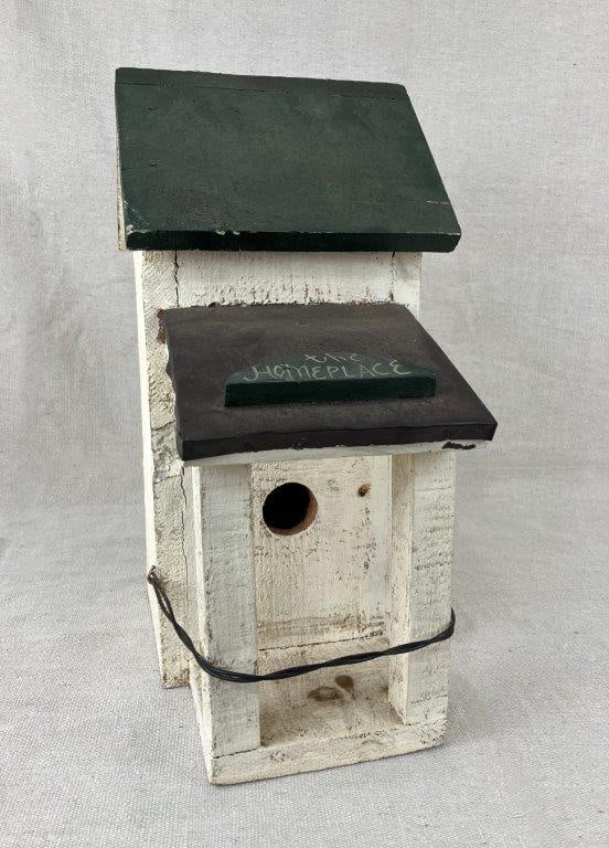 Painted Folk Art Birdhouse: A charming painted folk art birdhouse featuring wonderful multicolored decoration and designed as a small cottage with a front porch. Measures approximately 14 1/2″ H x 9″ W x 7″ D.