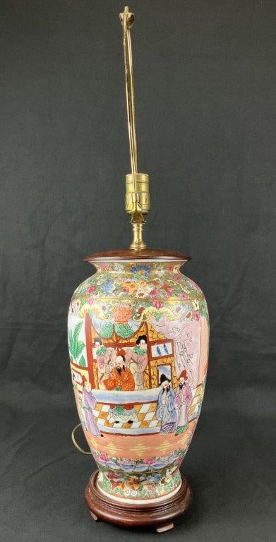Chinese Famille Rose Porcelain Vase Lamp: A porcelain vase lamp decorated in the famille rose palette, featuring narrative scenes of aristocratic Chinese figures with floral accents in traditional coloration. Mounted with rich, warm-toned