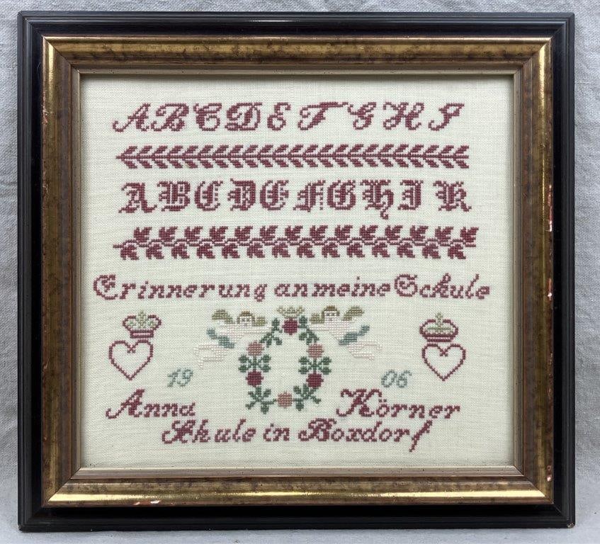 Antique German Cross-Stitch Schoolgirl Sampler: An antique German cross-stitch schoolgirl sampler worked in red thread by Anna Korner in 1906. Such samplers were traditionally created by young girls as both a record of educational achievement and a
