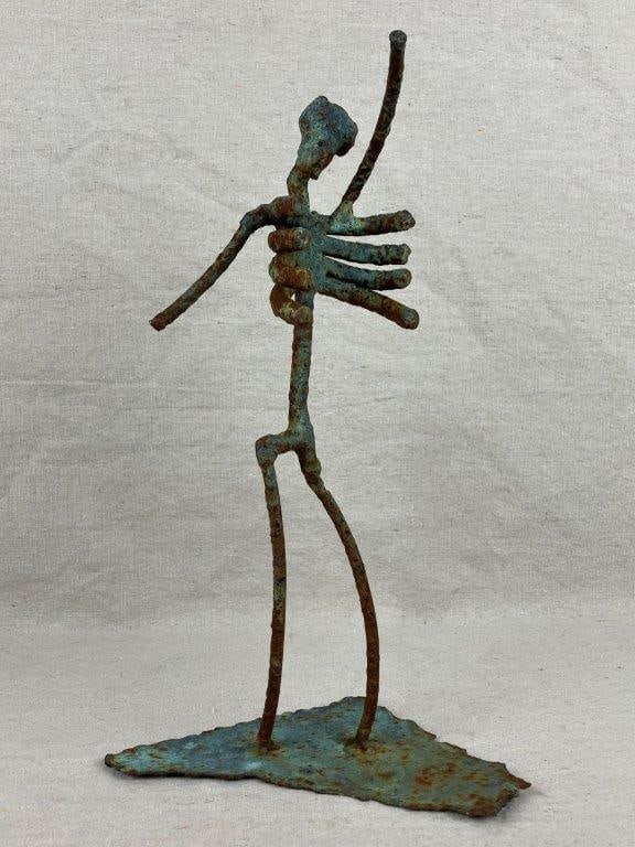 Folk Art Bronze Skeleton Sculpture: A folk art bronze sculpture in a brutalist style, depicting the stylized form of a human skeleton. Finished with verdigris and an aged patina. Measures approximately 13 1/2â€³ H x 6