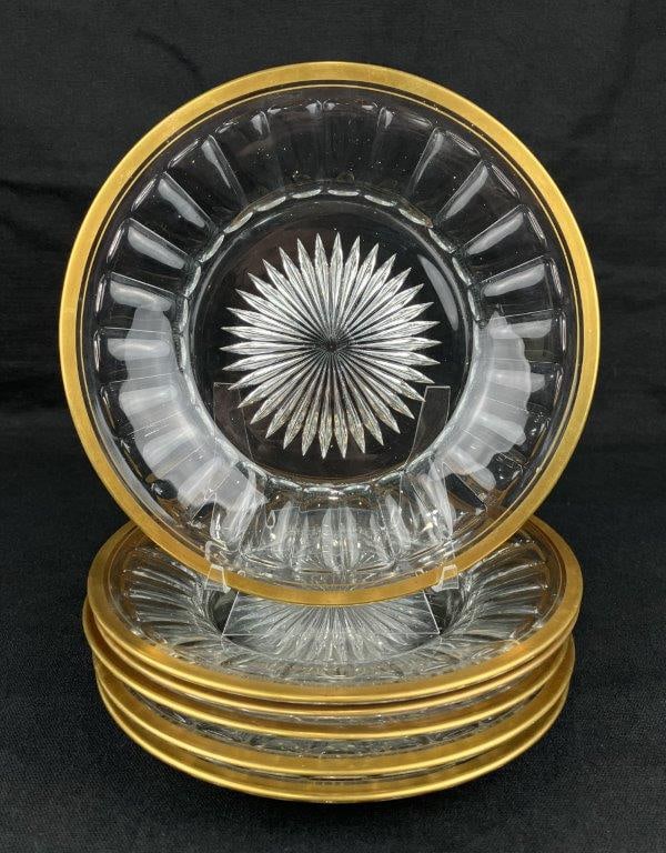 Six Heisey GIlt Edge Glass Bread and Butter Plates: A set of six bread-and-butter plates by Heisey Glass Company, featuring gilt edges and a central radiating design that showcases prismatic glass clarity. One plate measures approximately 1