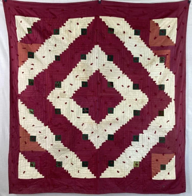 Antique Log Cabin Quilt: An antique quilt in the classic Log Cabin pattern, arranged in a striking geometric diamond layout. Rich red tones are accented with green against a soft cream ground, creating strong visual contrast