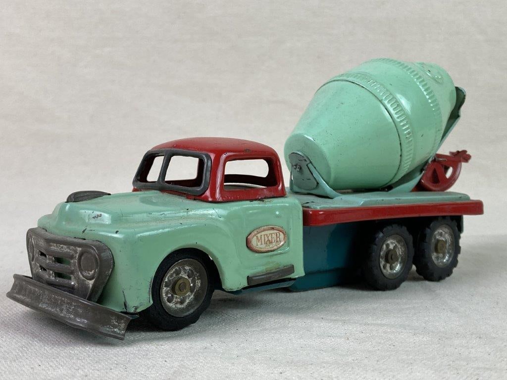 Vintage SSS Japan Tin Cement Mixer Truck: A teal and red tinplate cement mixer truck manufactured by SSS Japan. Friction-powered, with a rotating mixer drum activated when rolled, and marked â€œMixerâ€ to the