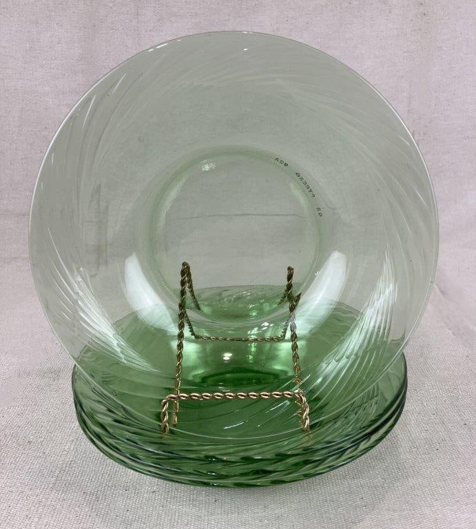Four Pyrex Festiva Green Swirl Rim Bowls: A set of four Pyrex Festiva bowls by Pyrex, featuring spring green coloration and the distinctive swirl pattern around the rim introduced in the 1970s. One bowl measures approximately 1 3/4″ H