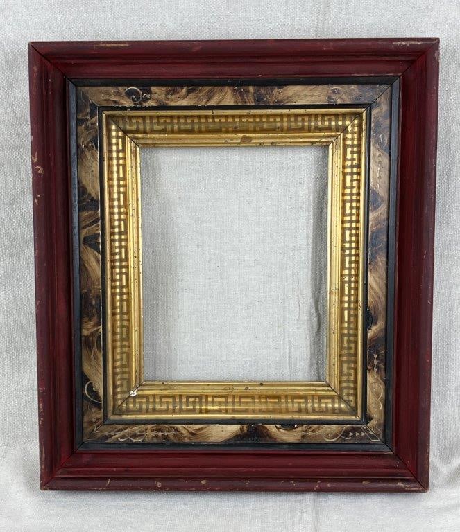Red Polychromed Frame with Gilt Greek Key Design: An antique polychromed frame featuring a red-painted exterior and a brushed gilt liner with intricate carved detailing. The innermost liner displays a classical Greek key motif in gilt, adding refined