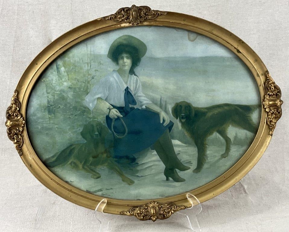 Hunting Print of Dogs and Victorian Woman: A print depicting a late 19th century–style scene of a Victorian woman in feminine hunting attire with an elegant coiffure, accompanied by two hunting dogs within a serene landscape. Housed in