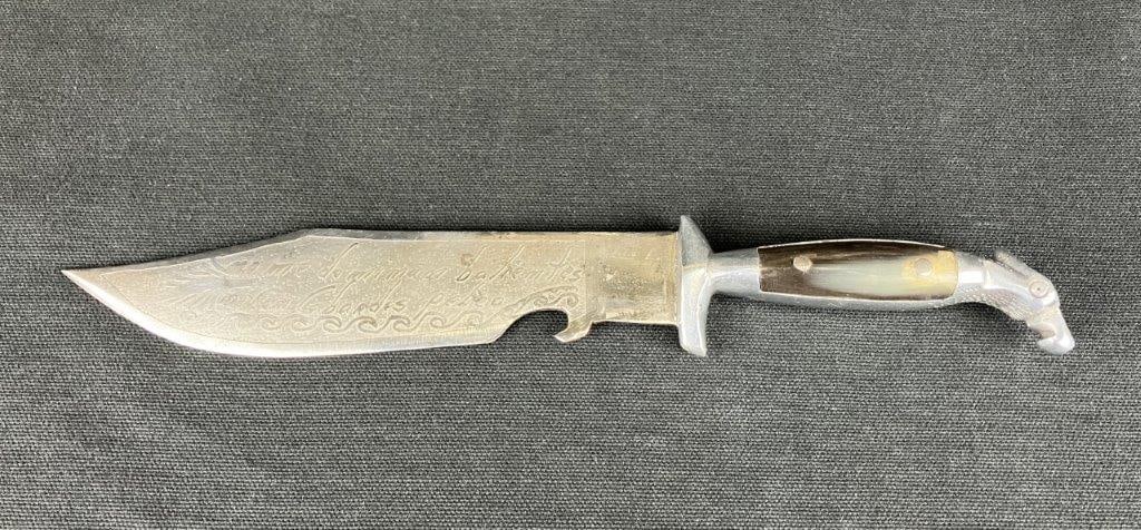 Mexican Oaxaca Knife: A Mexican knife featuring an etched stainless steel blade decorated with a running deer and foliate motifs. One side of the blade reads â€œHecho en Oaxaca Por