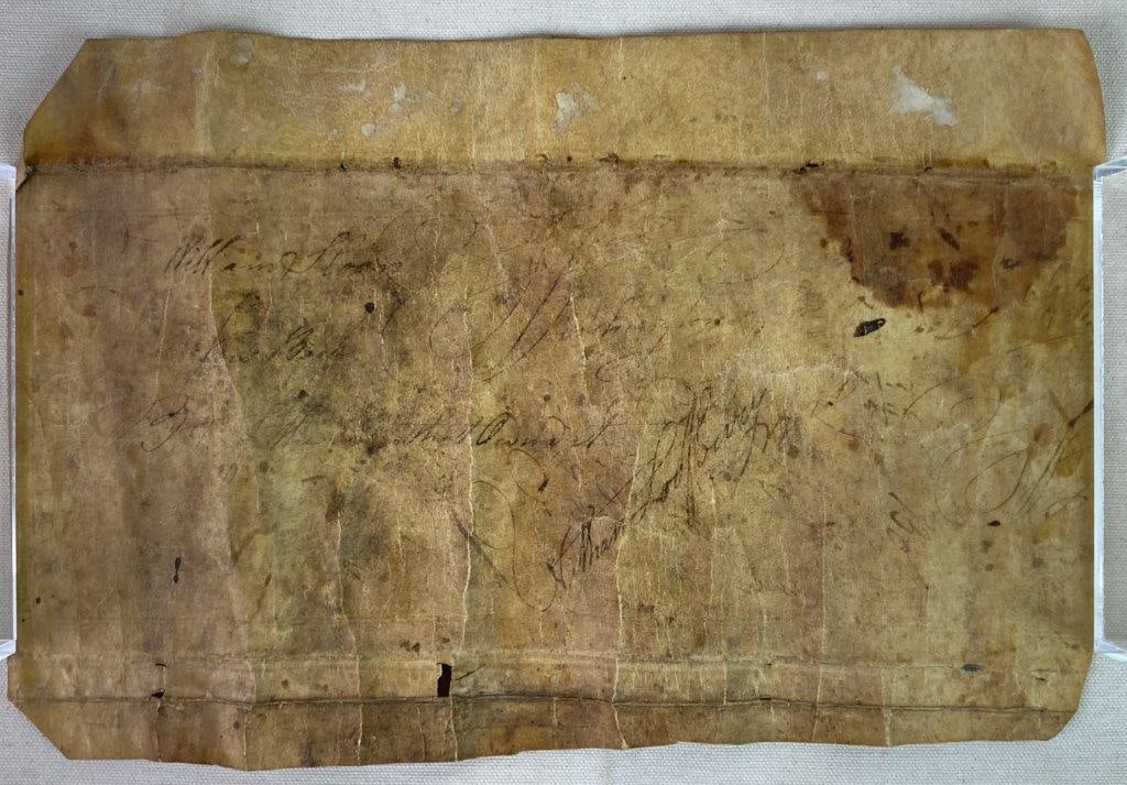 Leather Document: An antique leather document with handwritten notation. One side is titled â€œReceiptsâ€ with numbers written below; the reverse bears the name William Sloan along