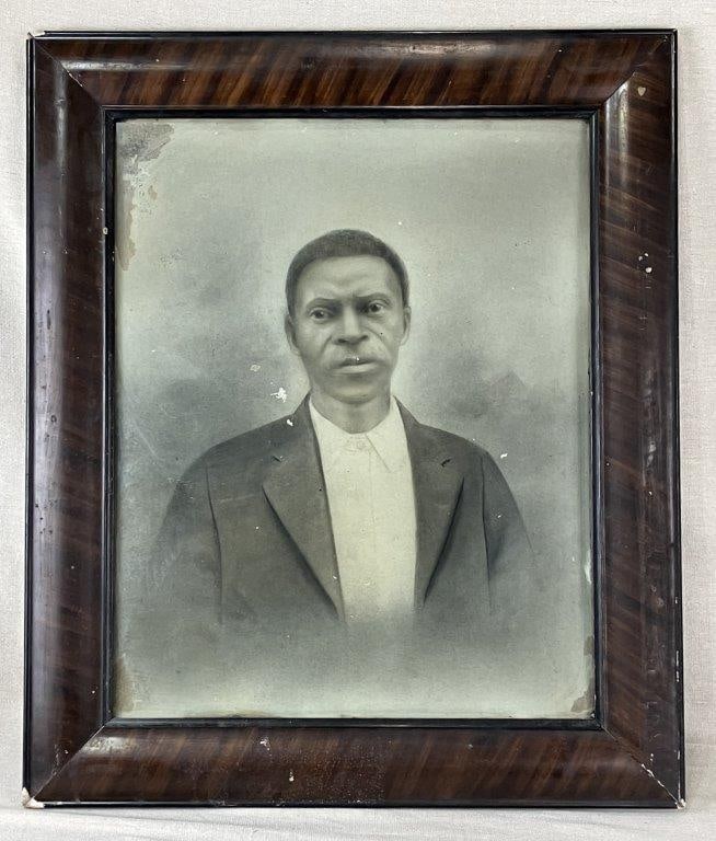 Black Americana Early 20th Century Enhanced Photograph: An early 20th century photograph depicting an African American man in formal dress, possibly executed in the carbon print process with drawing enhanced features popular during the period. The dignifie